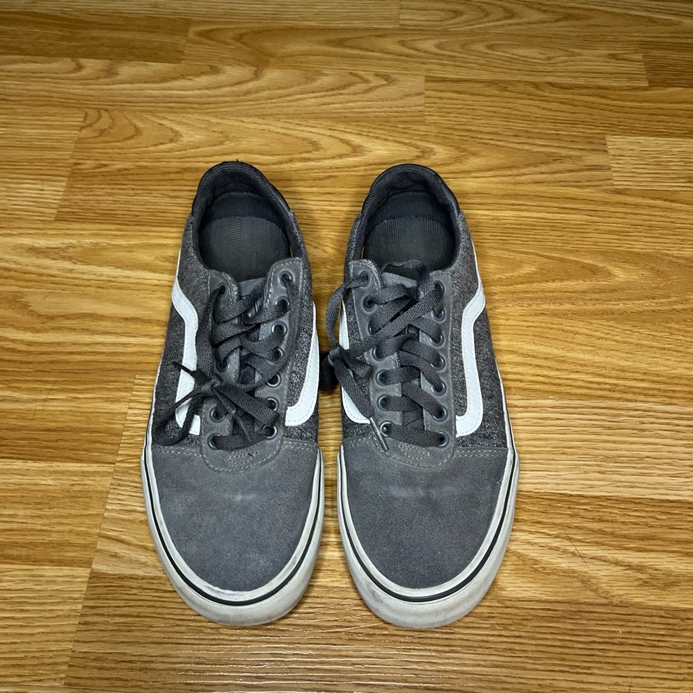 Grey and white Vans sneakers